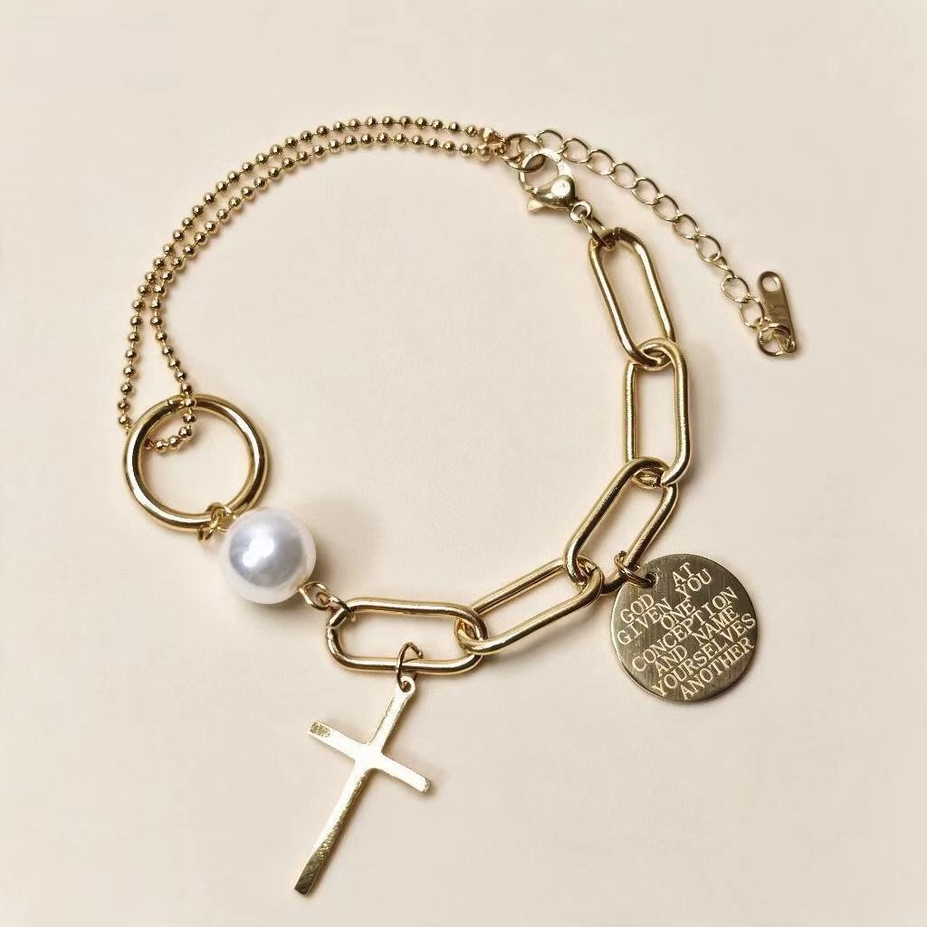 18K gold plated layered paperclip chain bracelet with cross, pearl and engraved coin charm