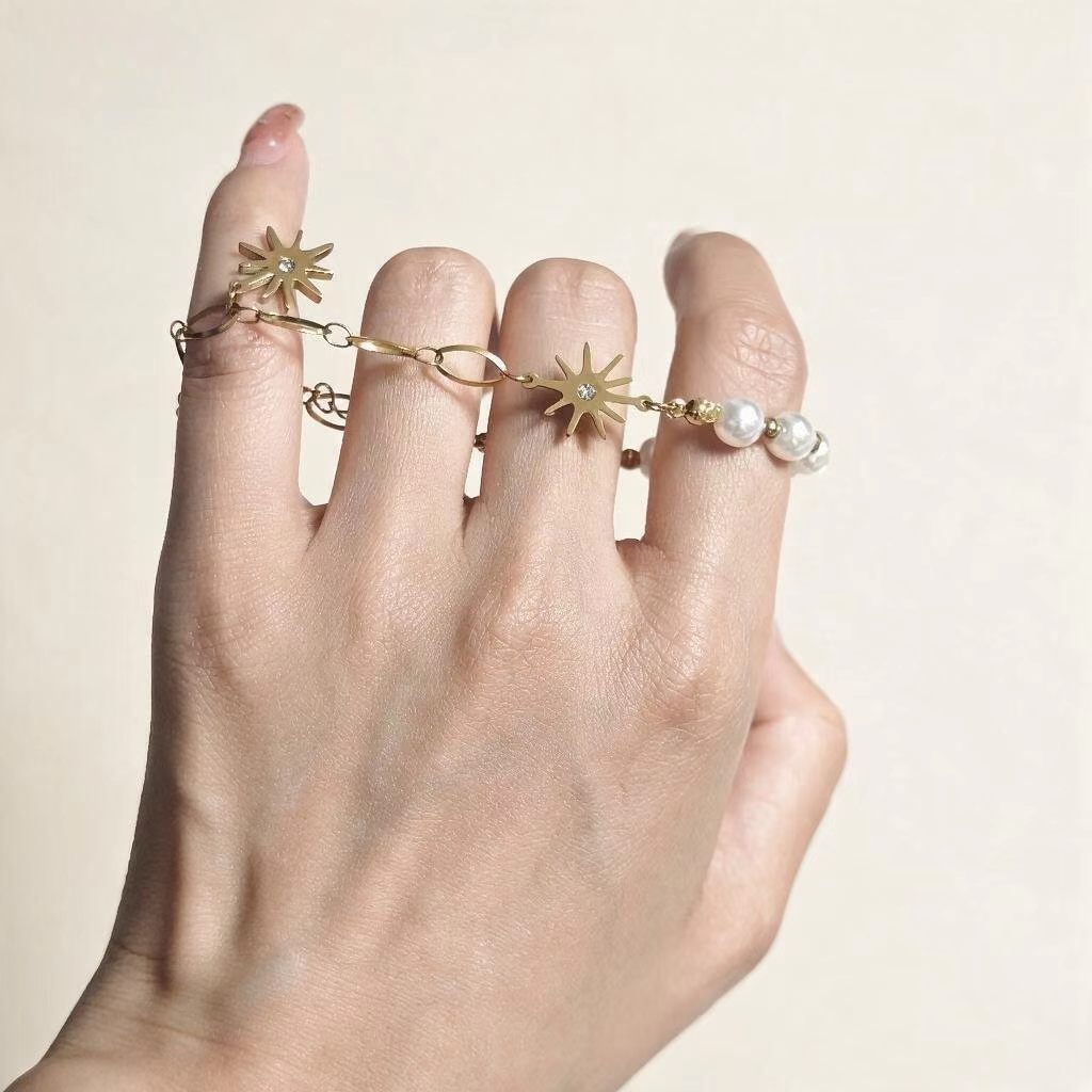 Delicate PVD gold plated stainless steel bracelet with sunburst charms and faux pearl, women everyday jewelry