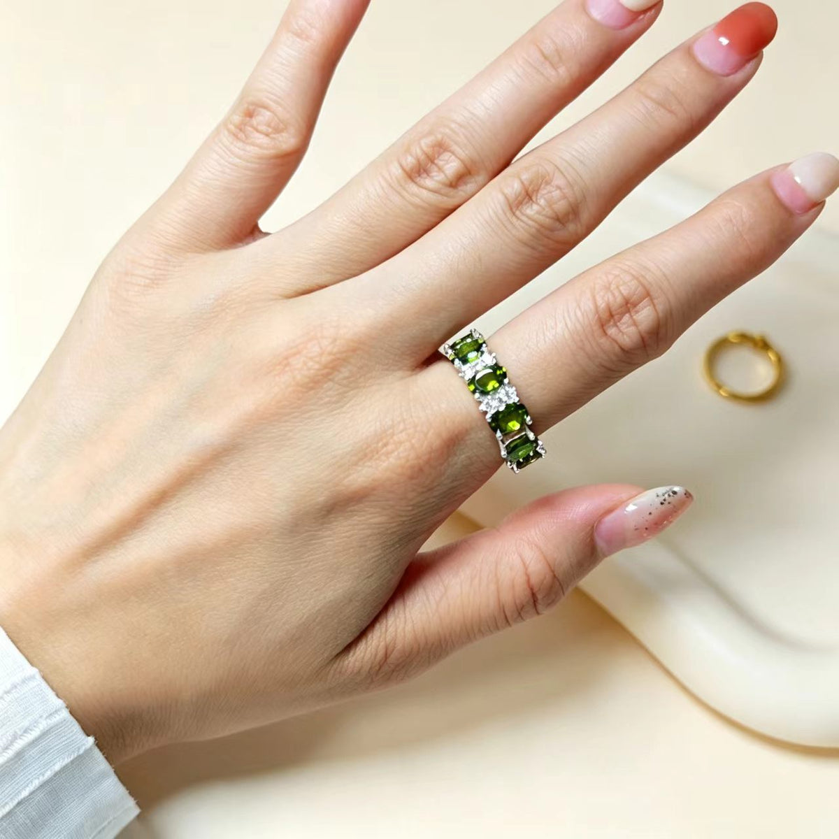 Olive green stacking ring worn on hand