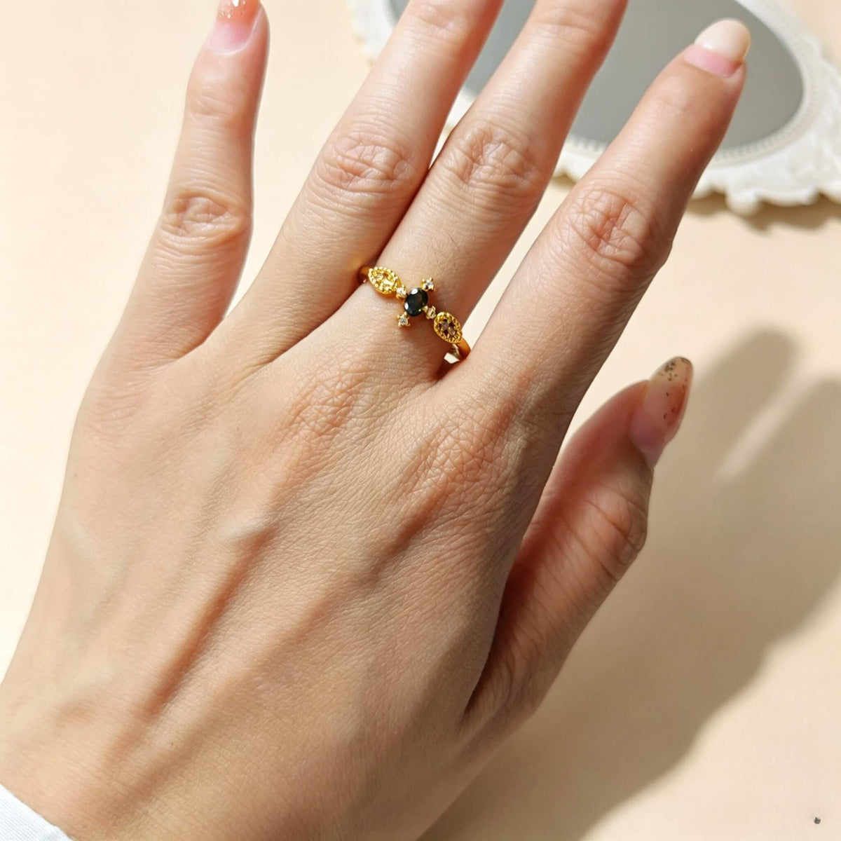 Vintage floral gold adjustable copper cocktail ring on hand, with oval green cubic zirconia, stackable dainty women jewelry for daily styling